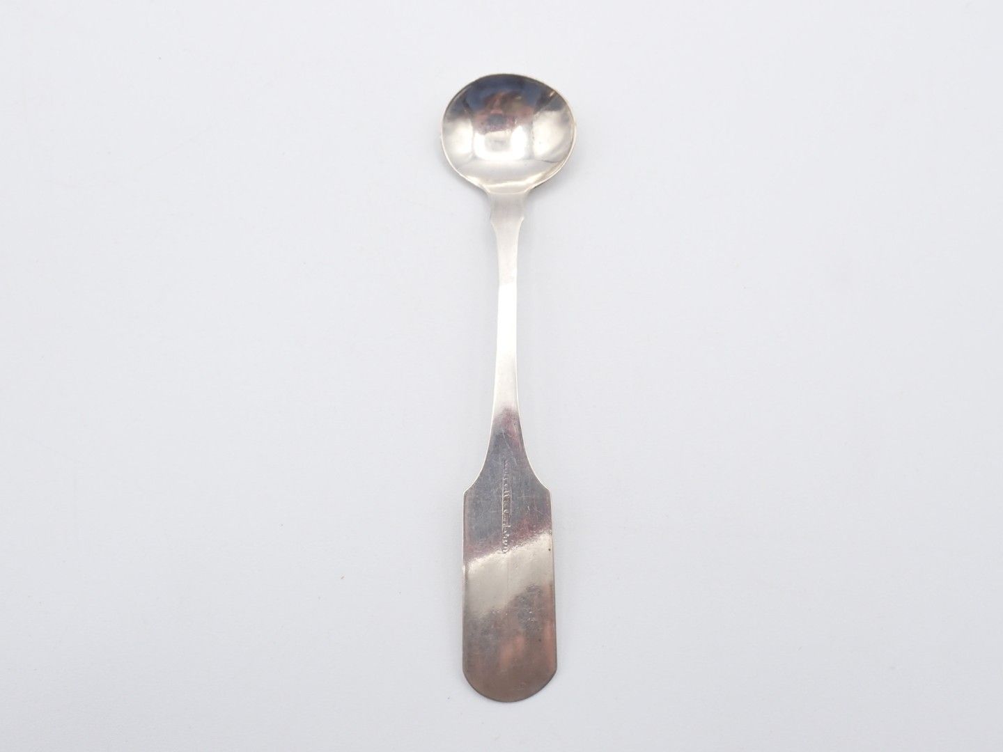Silver spoon on a white background