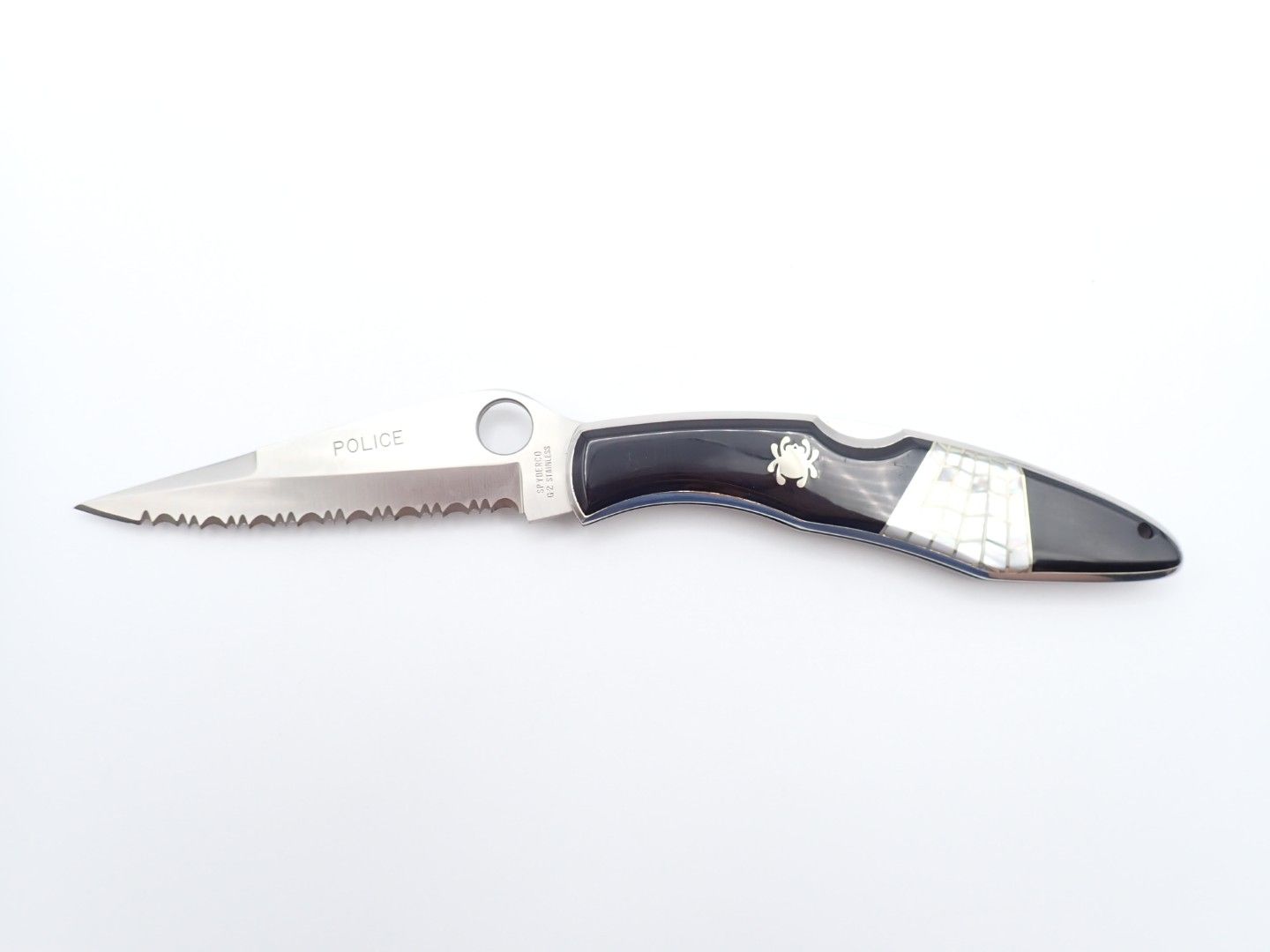 Silver folding pocket knife with a black handle on a white background