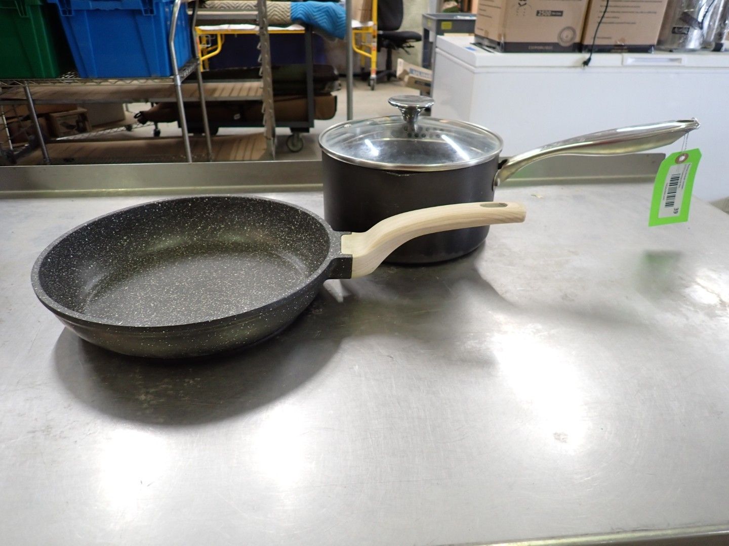 Two frying pans and a lidded pot