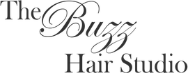 The logo for the buzz hair studio is black and white.