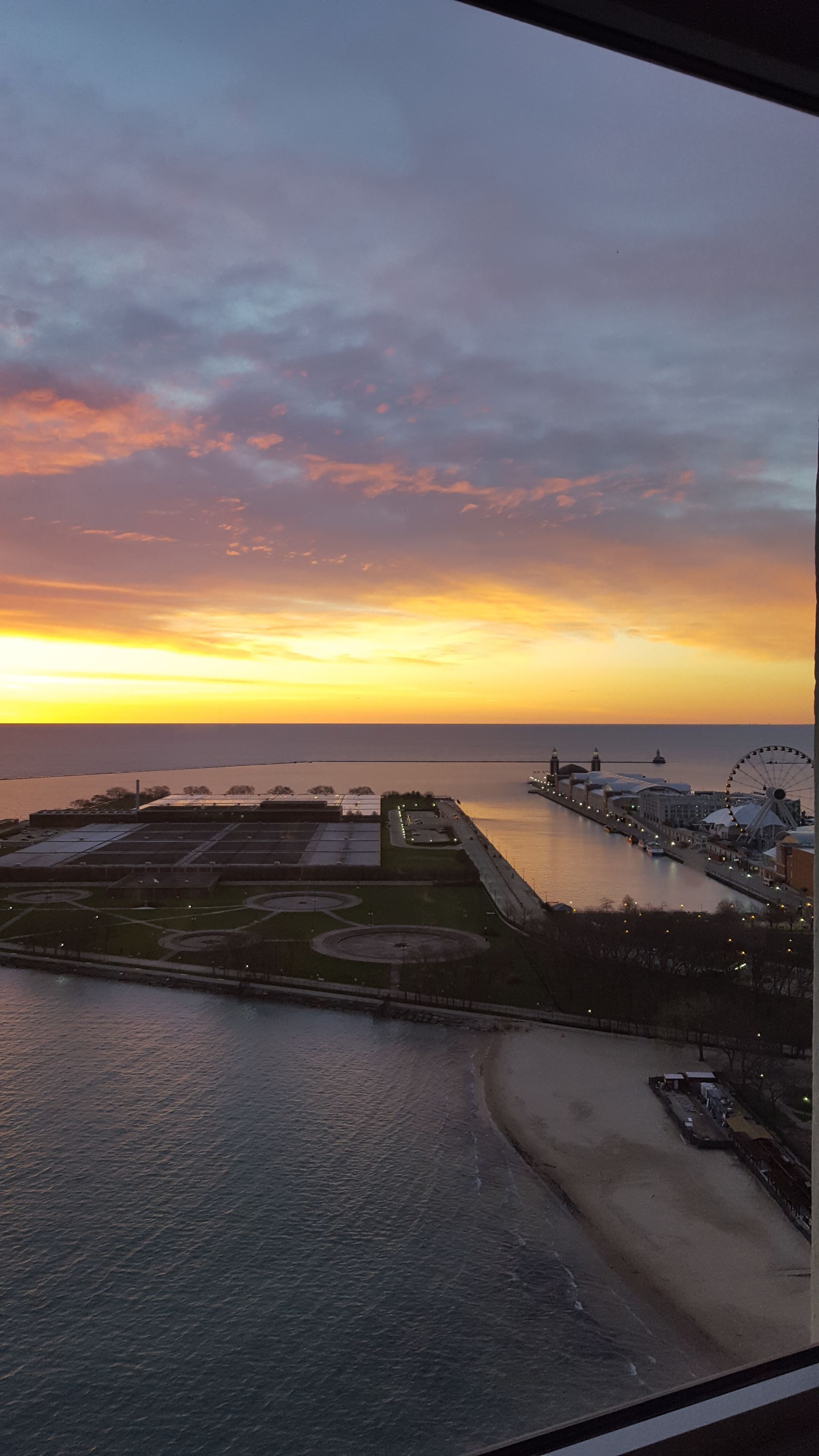 A dining room with a round table and chairs.