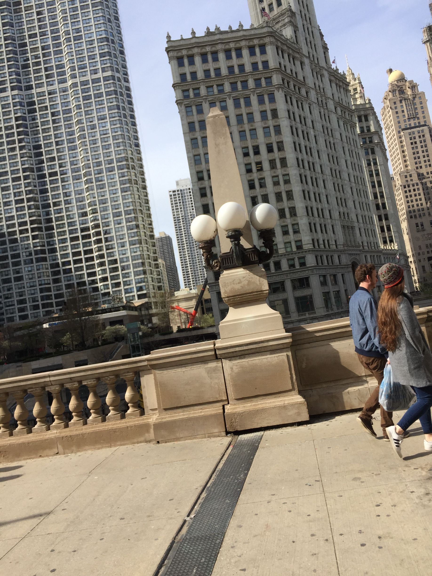 A vase of flowers is sitting on a table next to a window.