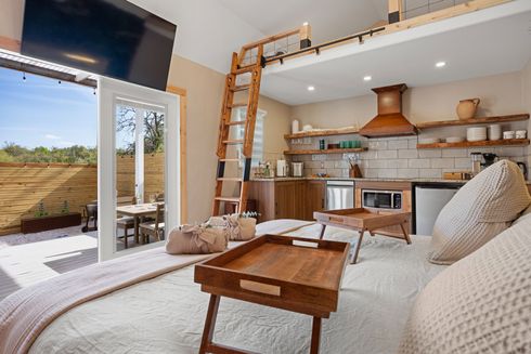 King bed in the lofted suite inside Alebrije cabin, the most secluded cabin at Avandaro Ranch