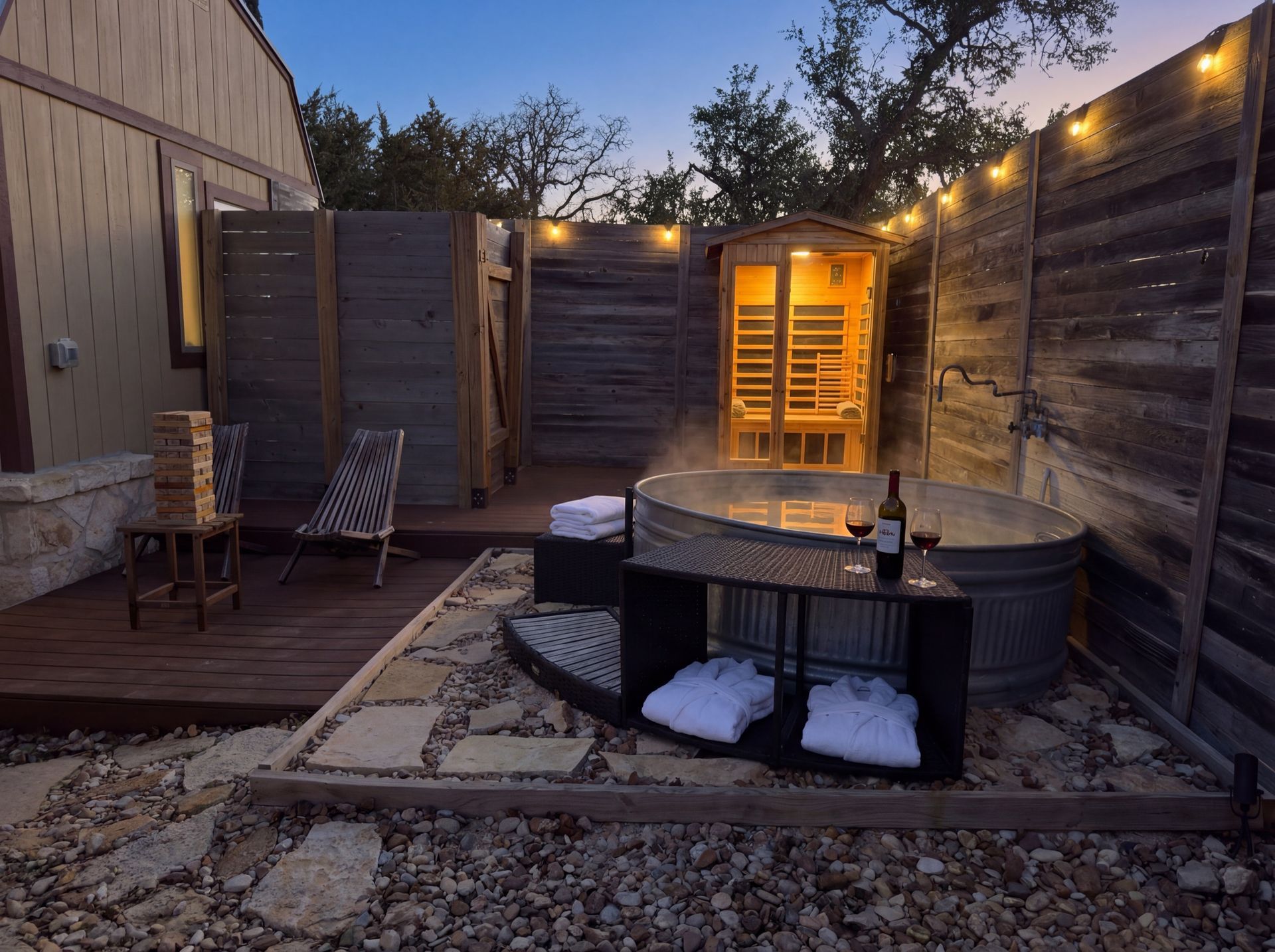 Private spa yard with infrared sauna and cold plunge at dusk at Avandaro Ranch
