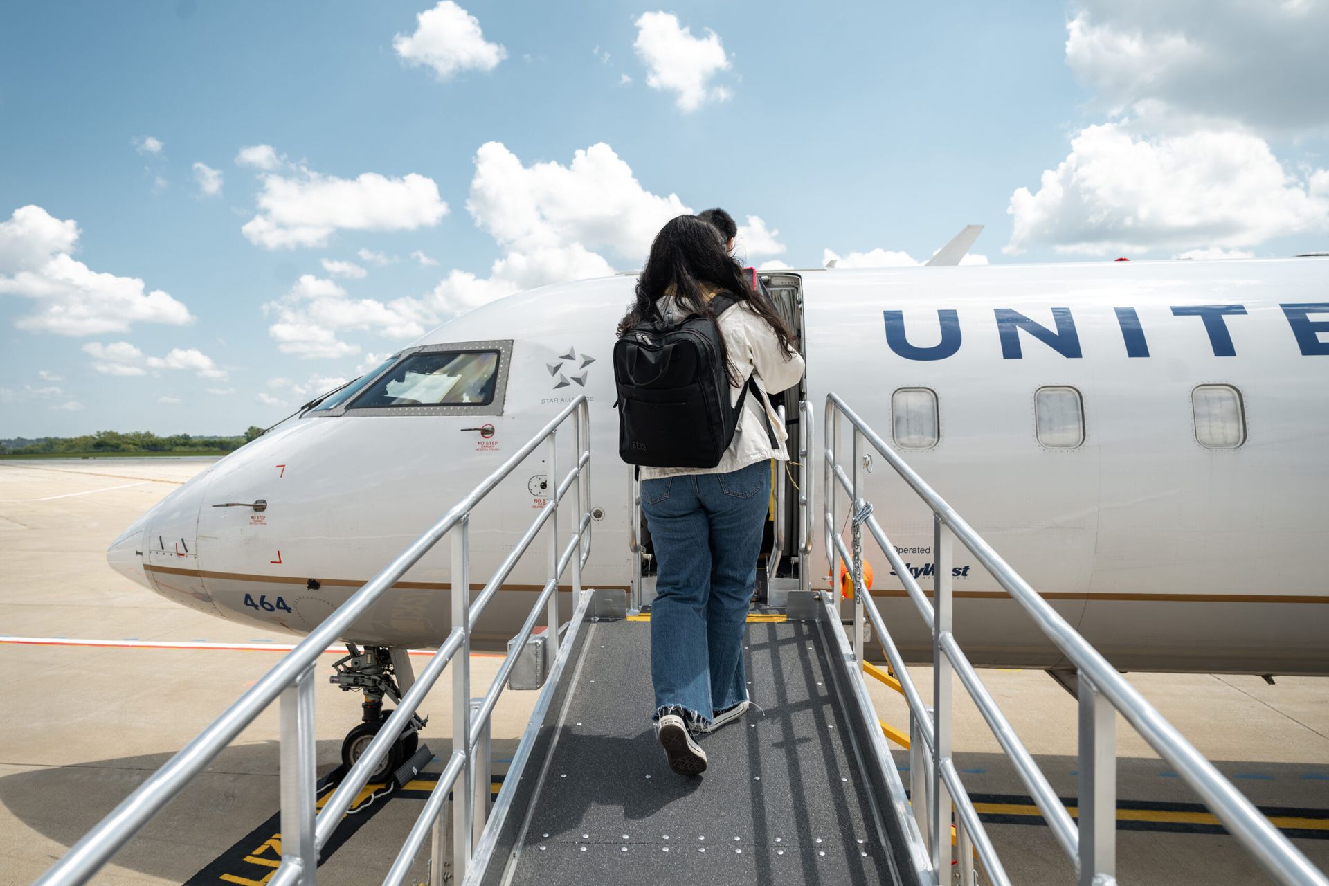 An airplane is parked on the tarmac at an airport