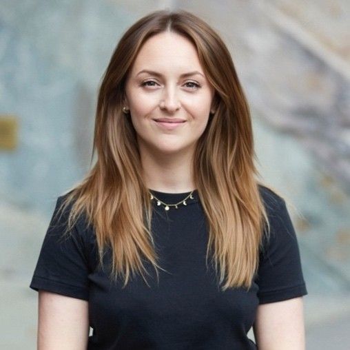one smiling woman with long hair