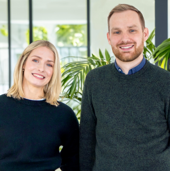 2 people in open plan office one man one woman