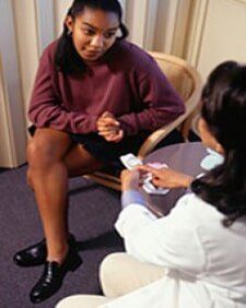 Nurse Giving Birth Control Pills - Pregnancy Care in Warren, OH