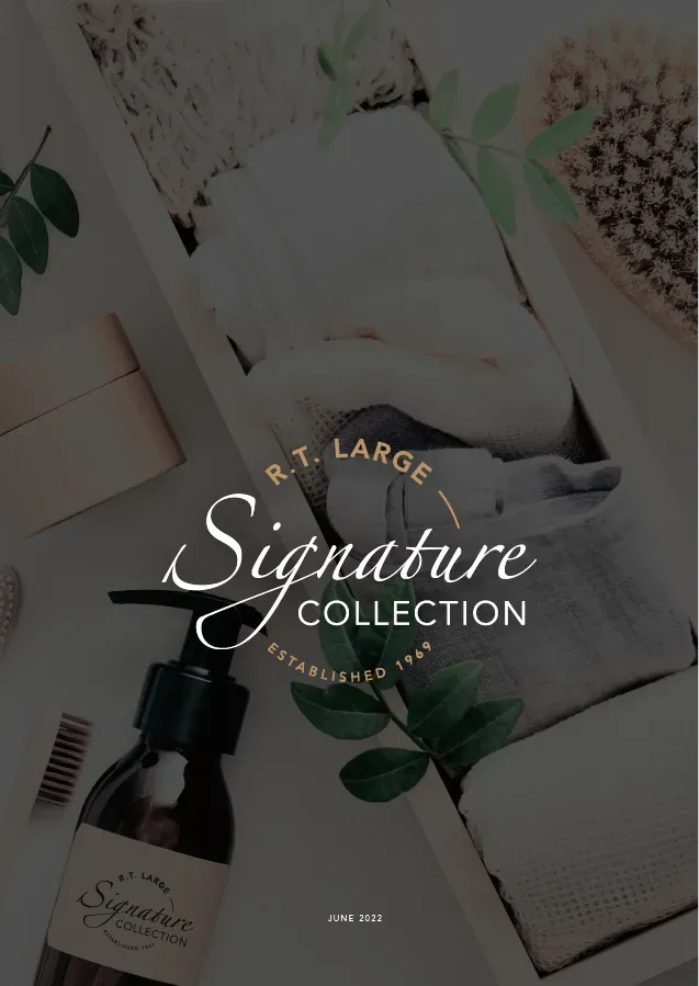 A bottle of signature collection sits on a table