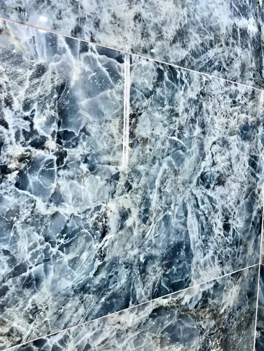 A close up of a blue and white marble tile.