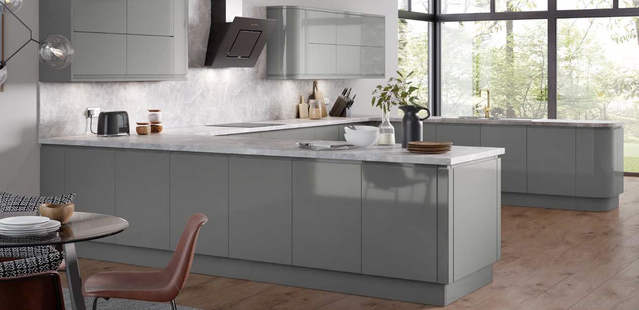 A kitchen with a table and chairs in it and a large window.