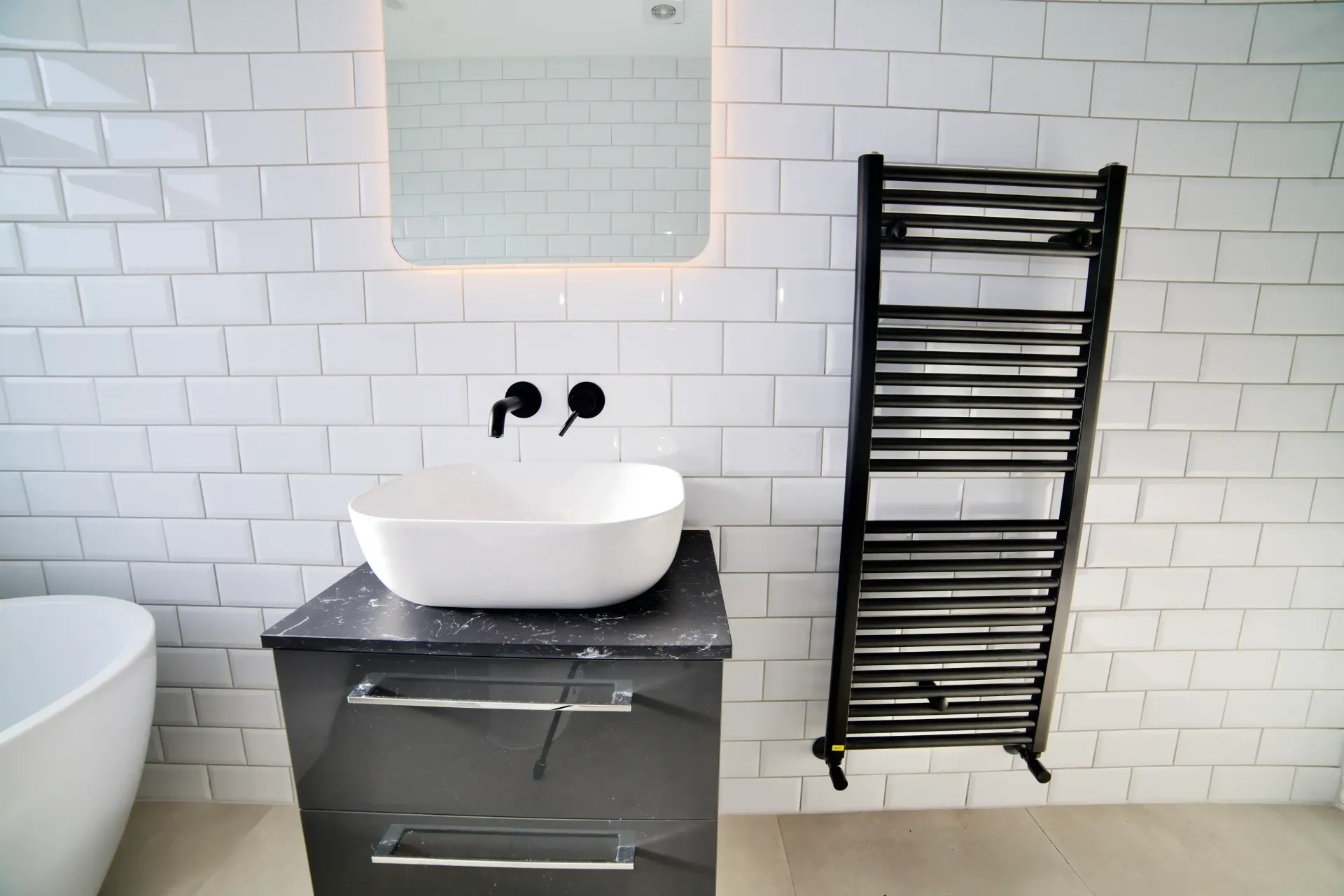 A bathroom with a sink and a towel rack