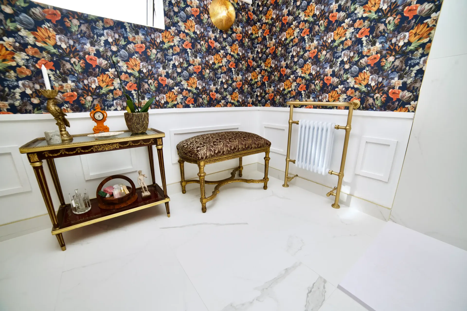 A room with a table , bench , and radiator.