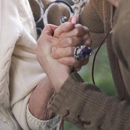two women holding hands