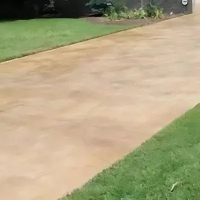 Newly poured, coloured concrete driveway in Outram.