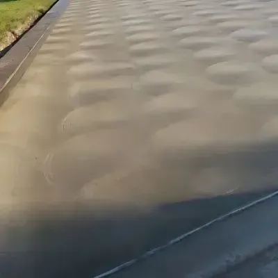 Distinctive swirl finish concrete driveway in Concord.