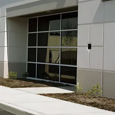 Recently installed concrete path along a commercial building in South Dunedin.