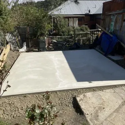 After: Concrete shed pad installation, white concrete slab finish, 10 metre square, Ravensbourne.
