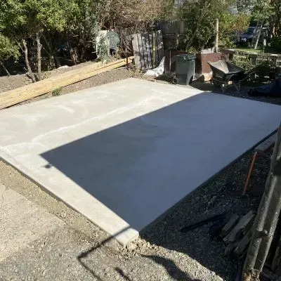 After: Concrete shed slab installation and completion, 10 metre square white concrete pad, Ravensbourne.