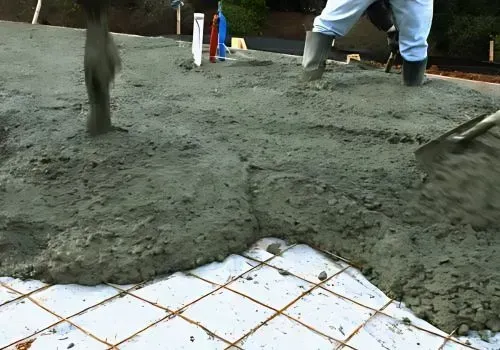 Concrete layers working on foundation, ensuring support with council compliances.