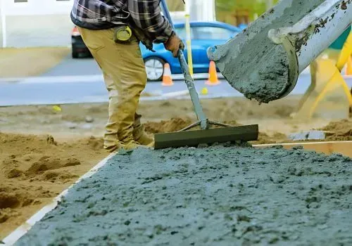 Dunners Concrete placers pouring and levelling a new driveway near Portsmouth Drive, Dunedin.