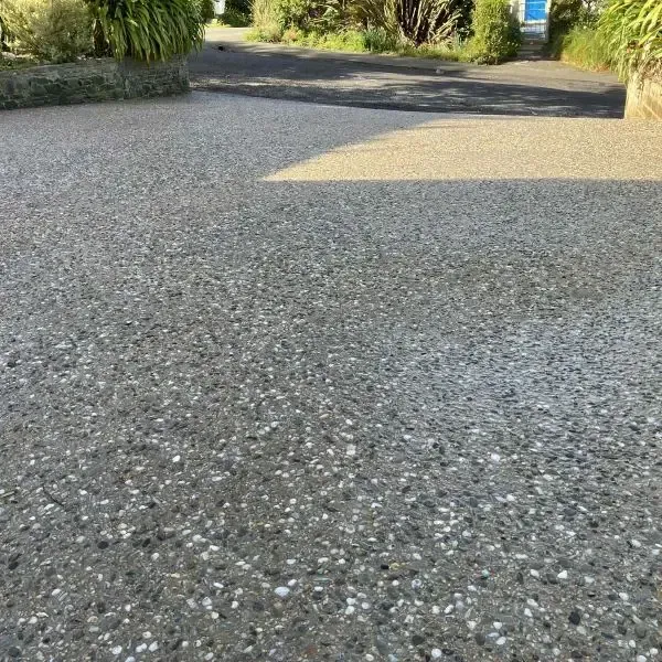 After: New 50msq exposed aggregate concrete driveway showcasing an end view shot, Macandrew Bay.