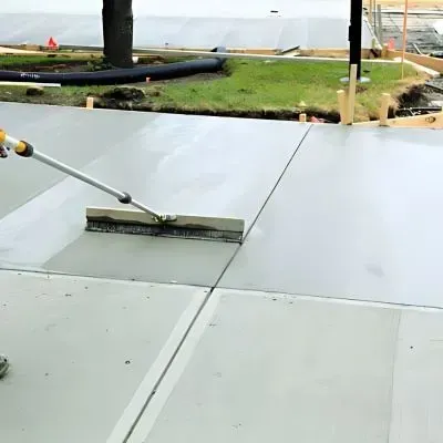 New concrete driveway being leveled for a Mosgiel business.