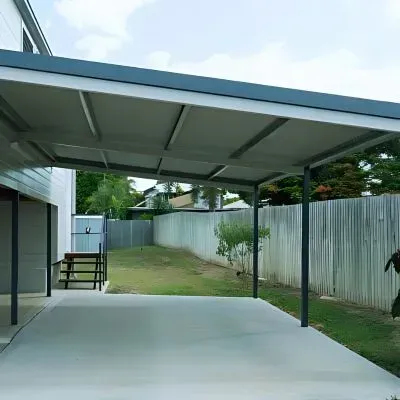 Newly placed concrete carport in Mornington beside a residential home.