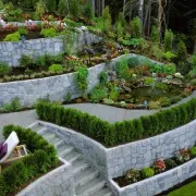Beautiful landscape with retaining walls and decorative concrete paths and surfaces.