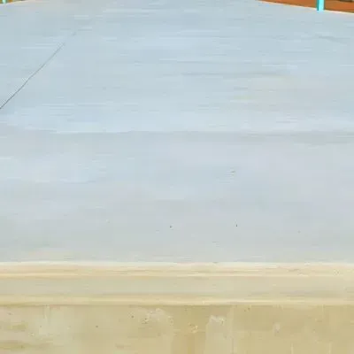 Precision-poured concrete pad with steel reinforcement for durability.