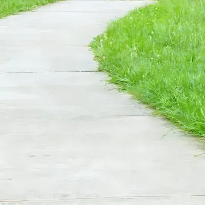 Custom concrete path installation with drainage by Dunners Concrete layers.