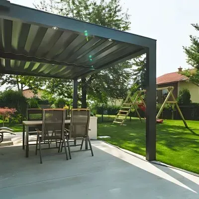 Textured concrete patio surface with proper drainage by Dunners Contractors.