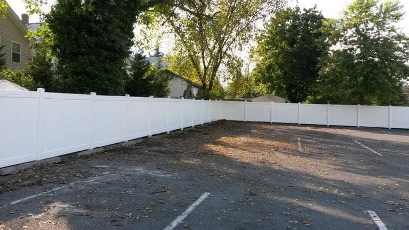 White Fence In Front Of House — Fence Repair in Williamsport, MD