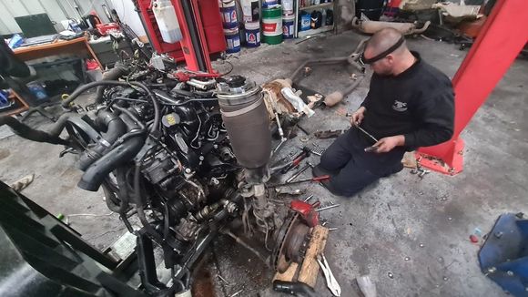 auto mechanic working in garage