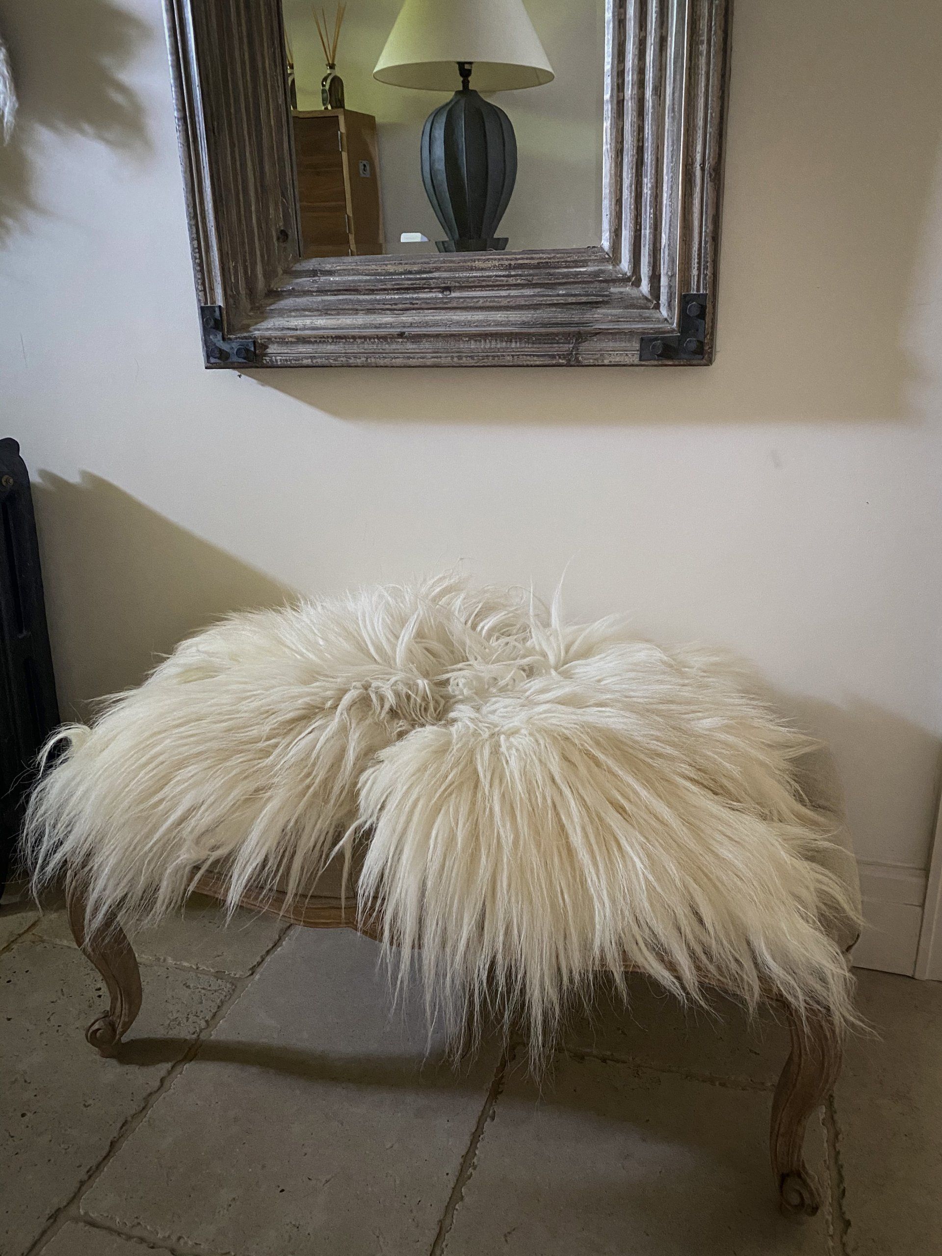 A luxurious addition to your living space a stunning small white felted fleece rug which would be perfect in any home