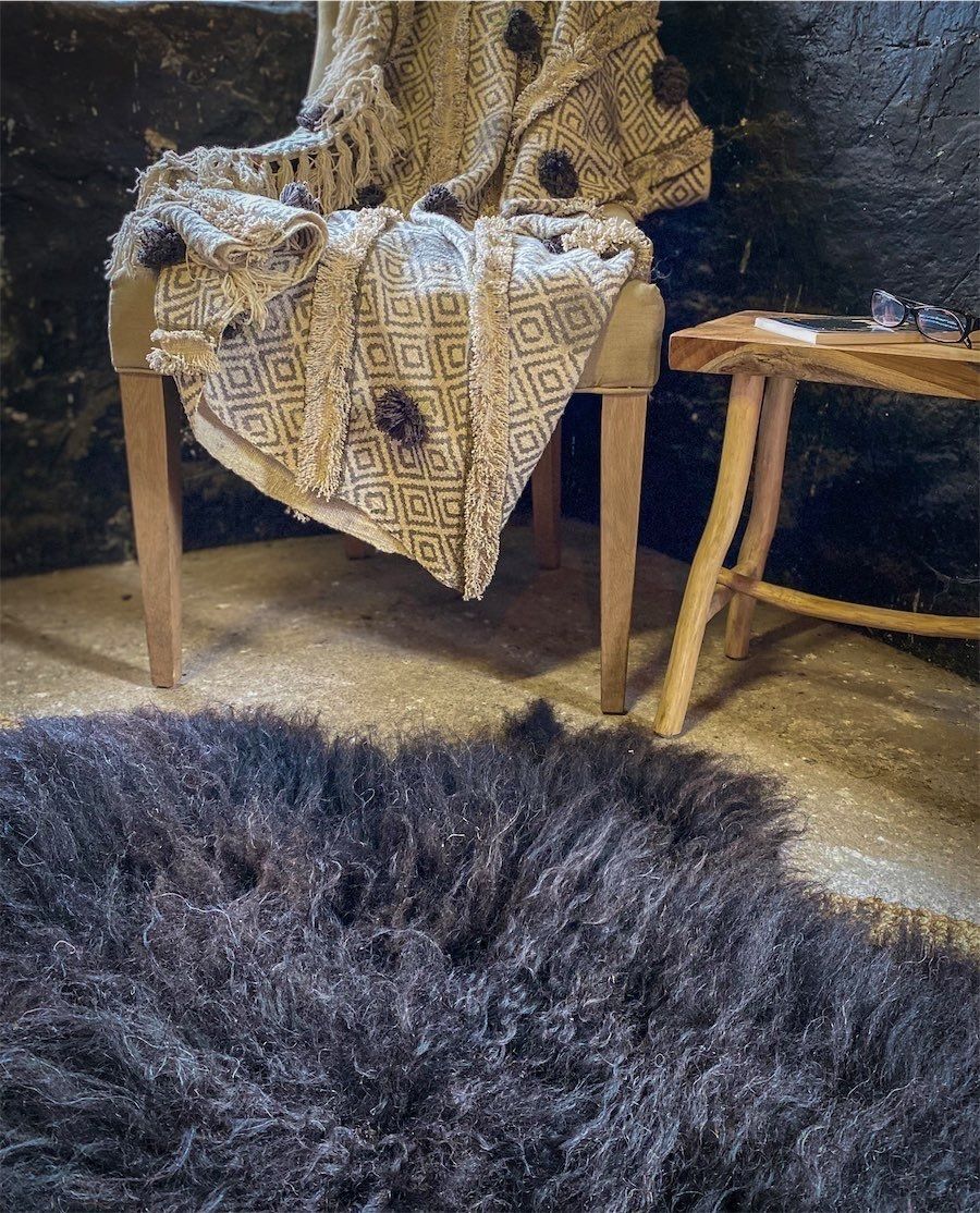 Lovely rustic felted wool rug in a rich brown. Great for keeping your feet warm on a footstool.