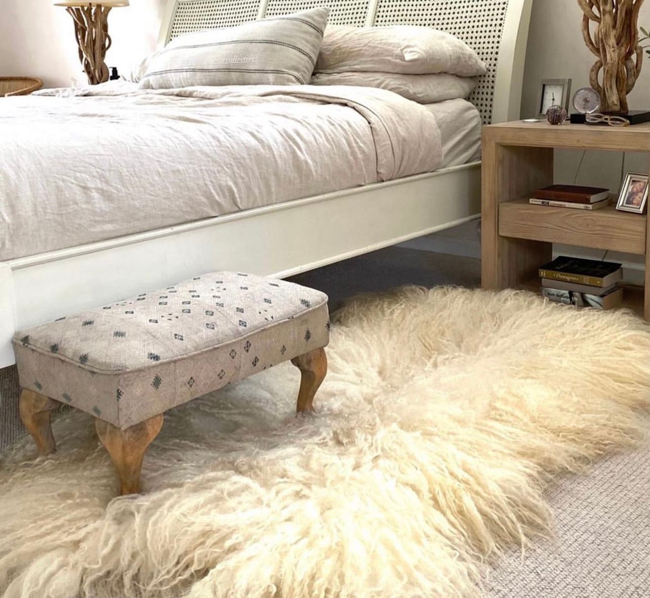 Valais Blacknose sheep felted fleece rug by Karolina Begier featured on the floor at Diani Boutique in California as part of their in-store collection.