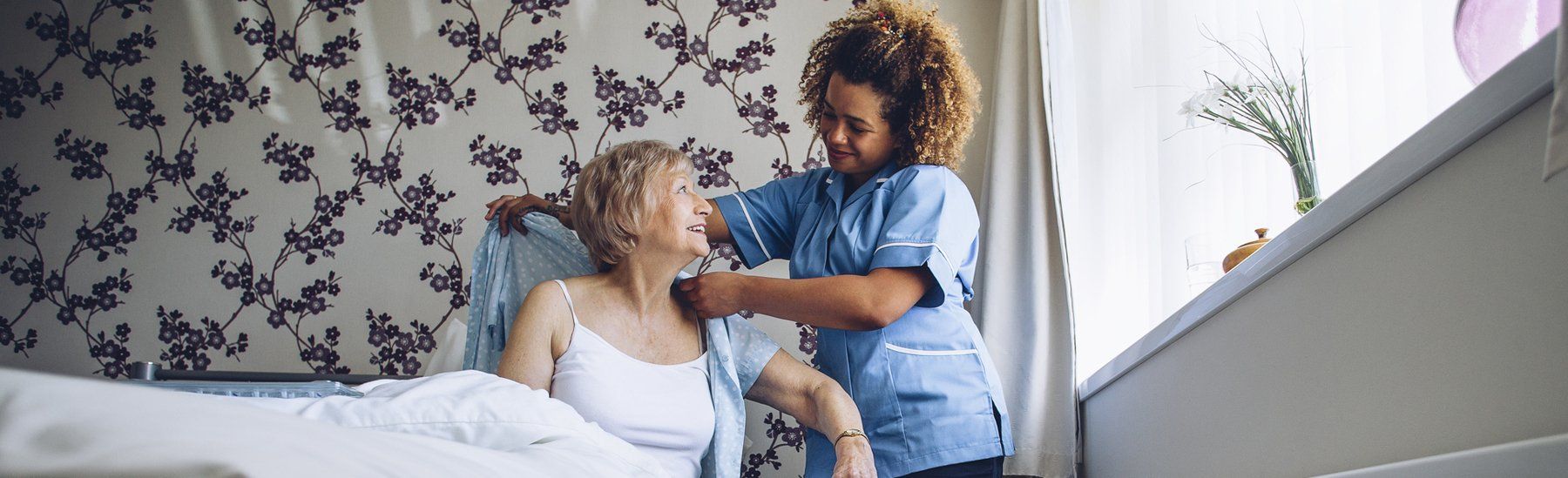 Caregiver Helping Senior Resident