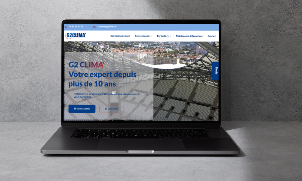 Un ordinateur portable est ouvert sur un site Web qui dit g2 clima