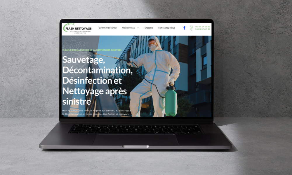 Un ordinateur portable avec une photo d'un homme en combinaison de protection sur l'écran.