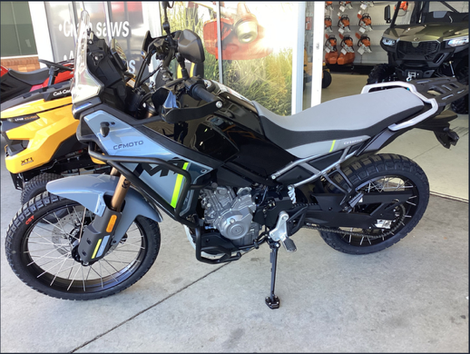 A Motorcycle Is Parked In Front Of A Glass Door In A Showroom — Coastal Farm & Motorcycles In Innisfail, QLD