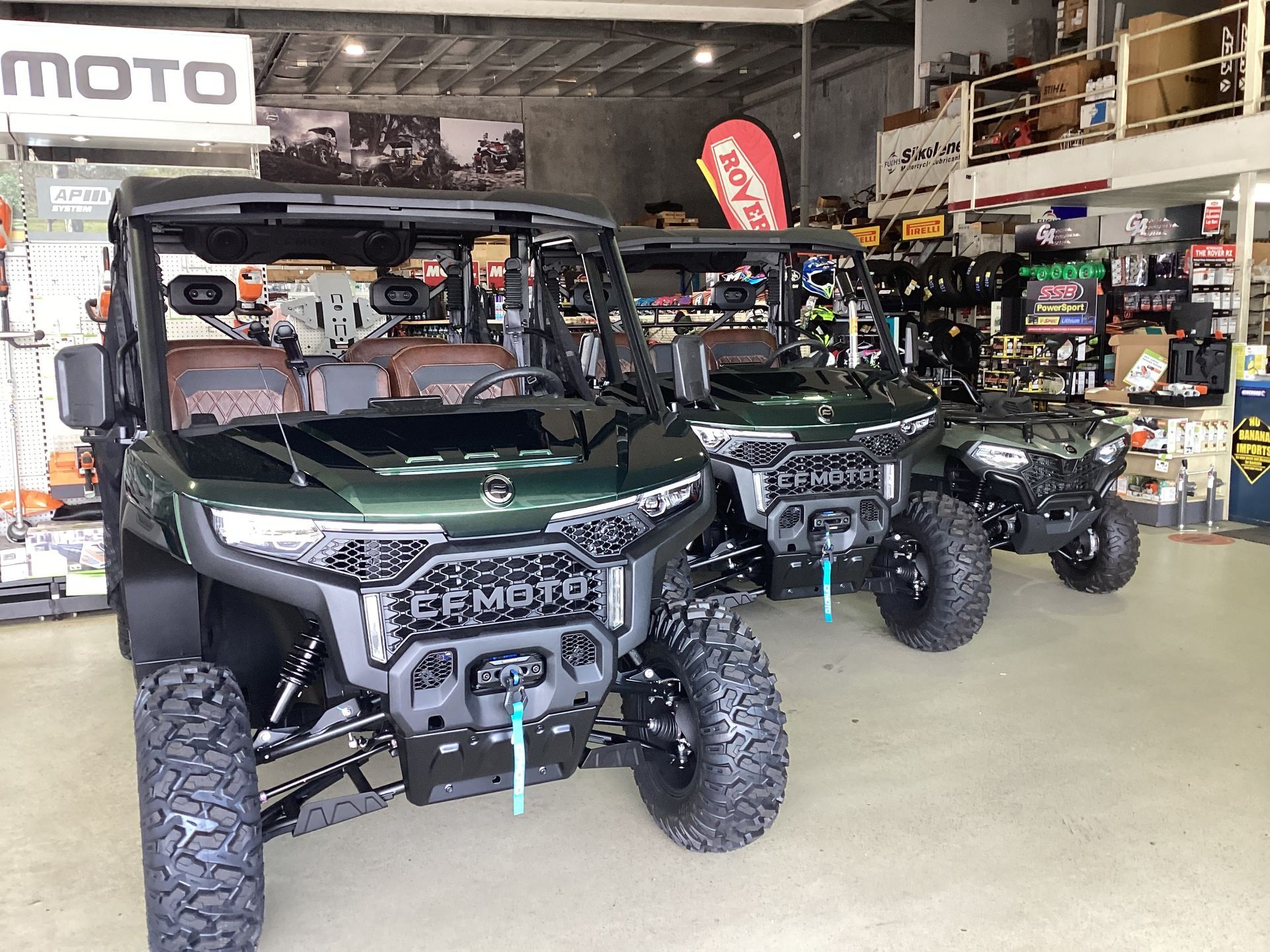 A Row Of ATVs Are Parked In A Showroom — Coastal Farm & Motorcycles In Innisfail, QLD