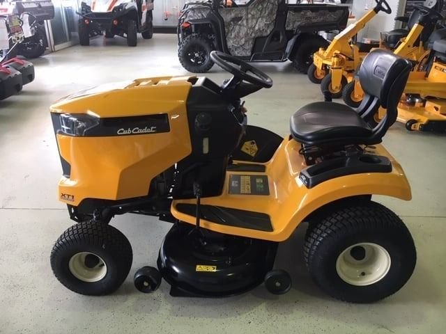 A Yellow Cub Cadet Lawn Mower Is Parked In A Garage — Coastal Farm & Motorcycles In Innisfail, QLD