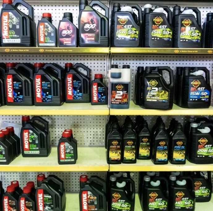 Many Bottles Of Motul Oil Are Lined Up On Shelves — Coastal Farm & Motorcycles In Innisfail, QLD