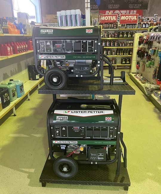 A Stack Of Generators In A Store With A Motul Sign In The Background — Coastal Farm & Motorcycles In Atherton, QLD
