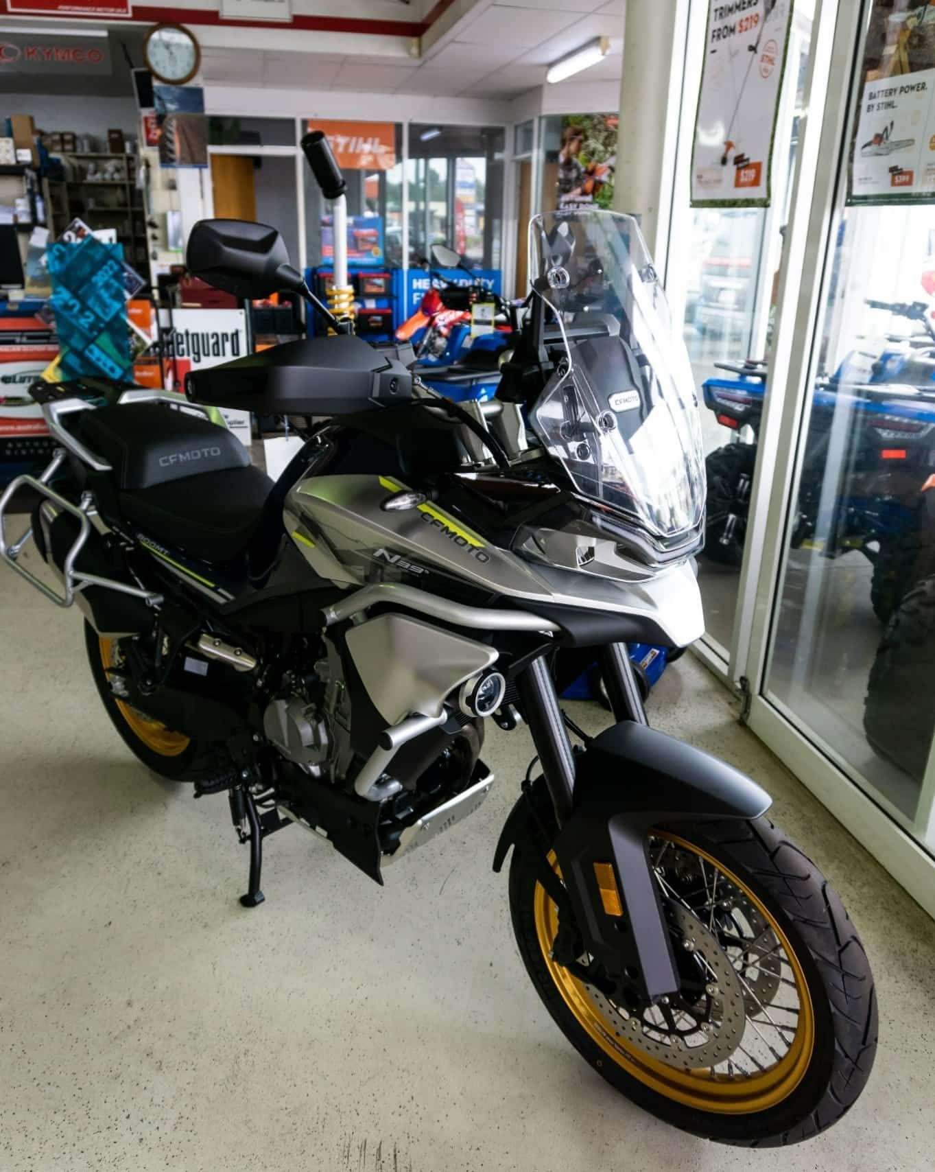A Motorcycle Is Parked In A Showroom In Front Of A Glass Door — Coastal Farm & Motorcycles In Innisfail, QLD