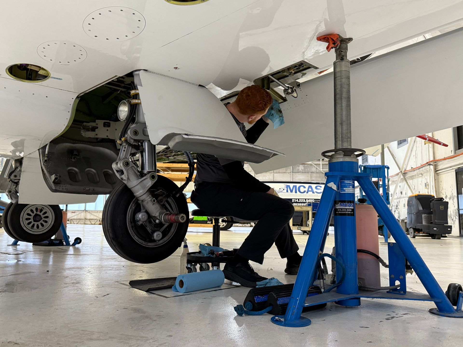 A large passenger jet is parked on the tarmac at an airport.