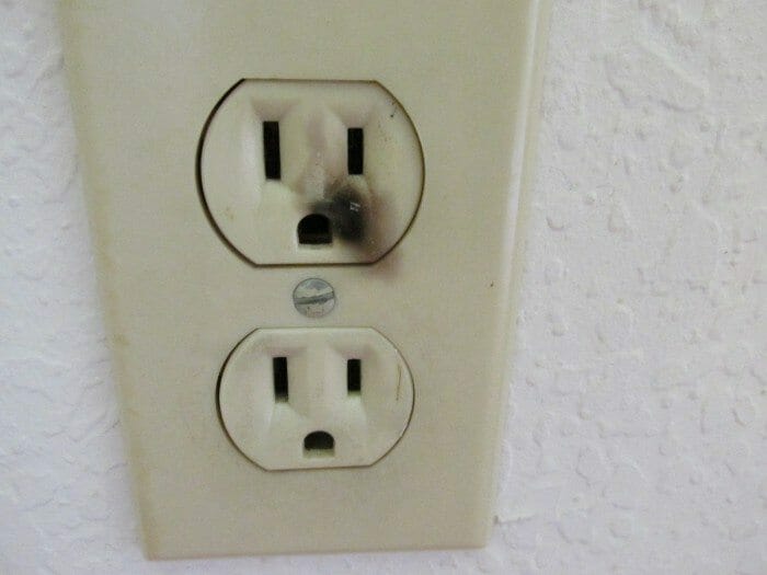 A close up of an electrical outlet on a wall