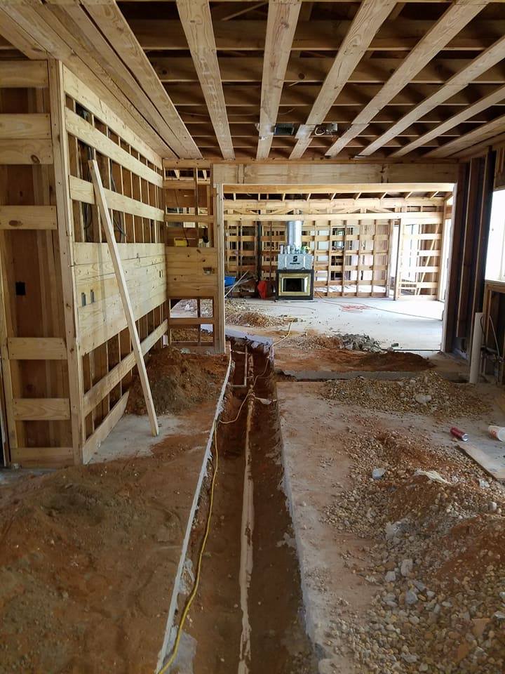 The inside of a house under construction with wooden beams