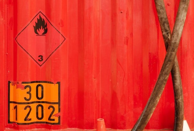 A red container with a sign on it that says `` 30 1202 ''.